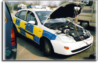 A police Ford Focus undergoing service to its air conditioning system